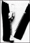 Close-up of a zipper half-open, revealing black fabric and a metallic pull tab. Demonstrates zipper functionality for textile projects.
